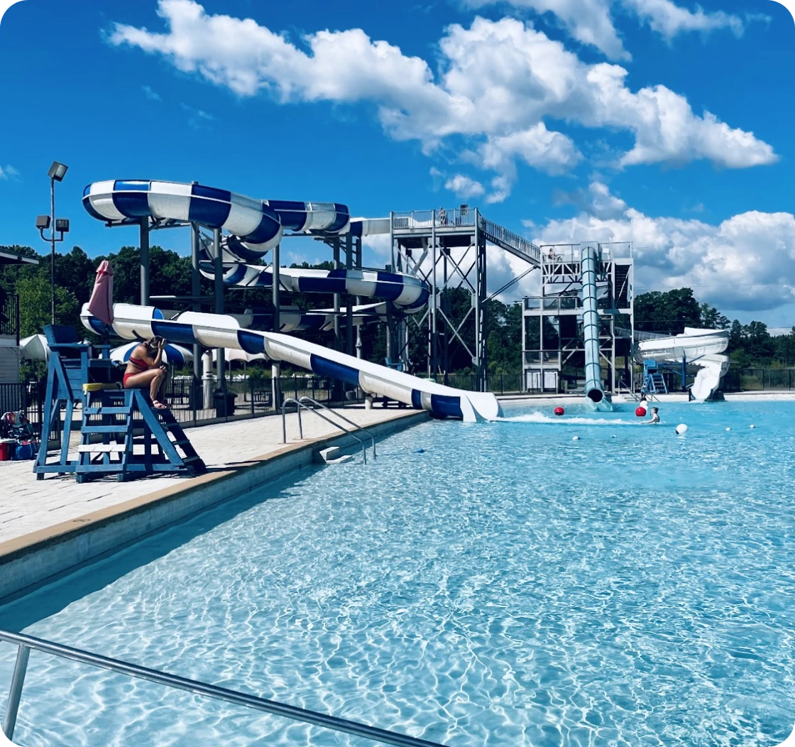 Water park with blue and white slides.