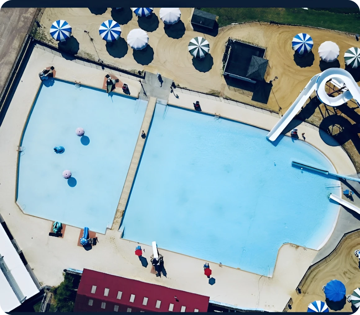 Pool with water slide and loungers